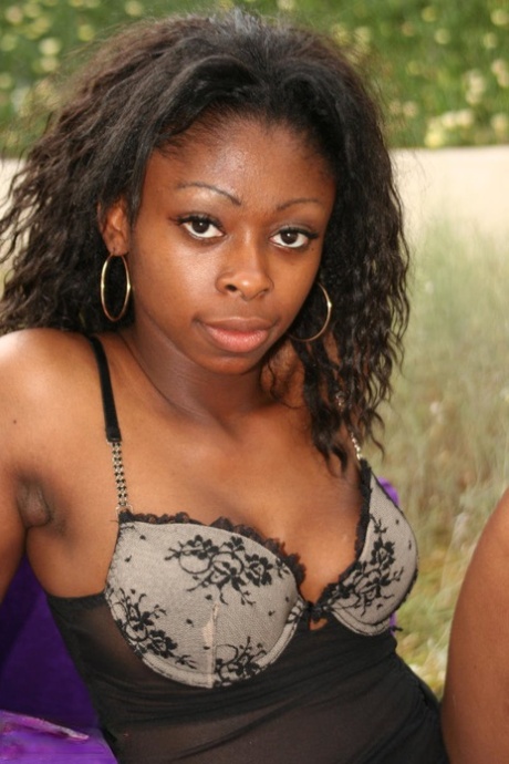Busty black girl Deja makes her nude modelling debut on outdoor furniture