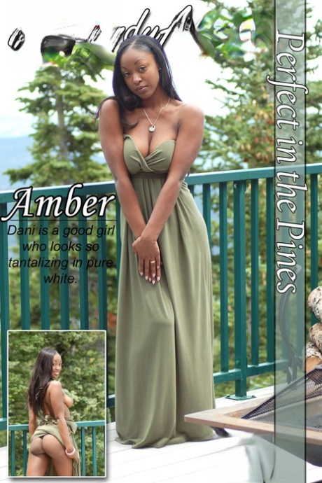 Ebony amateur Amber releases her big tits from a long dress on a balcony