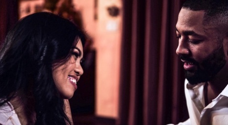 Asian girl Cindy Starfall has sex with a black man on a leather couch