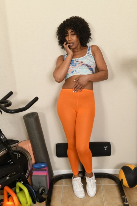 Ebony MILF Misty Stone gets completely naked while exercising at home