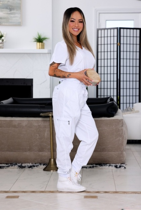 Blonde masseuse Linda Lan has interracial sex during a massage