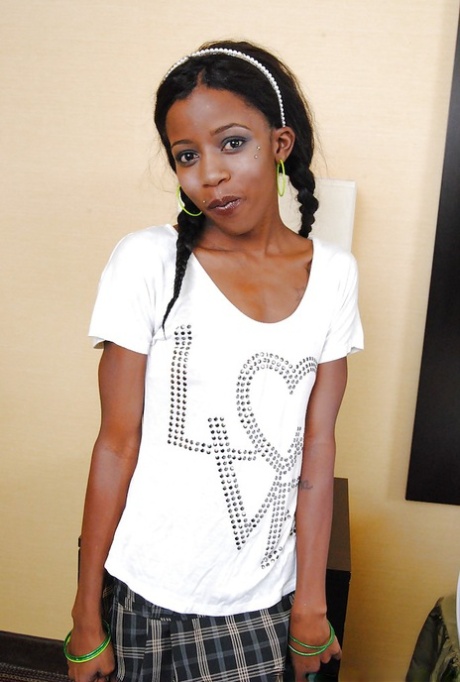 Naughty ebony cutie with pigtails revealing her inviting tight pussy