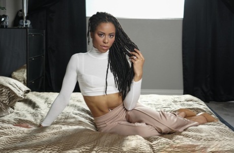 Ebony damsel Kira Noir shows her slender body & her black pussy in a hot strip
