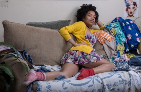American solo girl strips down to mismatched socks on her chesterfield