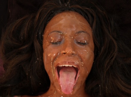 Ebony eats a white cock after masturbating with a toy and gets a huge facial