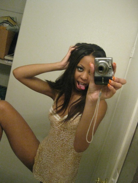 Cute ebony Jazmine takes selfies while stripping & rubbing her pierced cunt