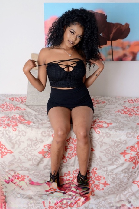 Adorable ebony Lala Camile shows her big breasts and stretches her vagina