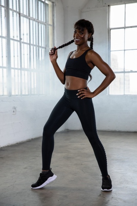 Glamorous ebony babe Foxxx strips after her workout and shows her sexy body