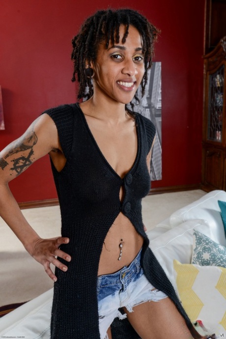 Slim ebony with dreadlocks Indie Cass reveals her hairy crotch in a solo