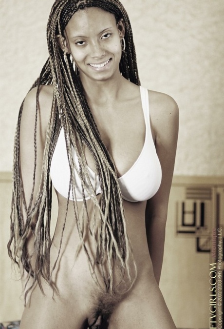Gorgeous ebony babe Monique shows off her big tits & spreads her hairy cunt