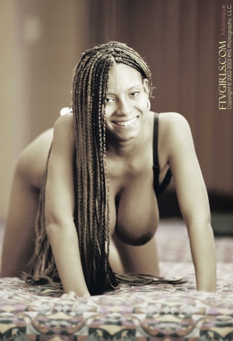 Gorgeous ebony babe Monique shows off her big tits & spreads her hairy cunt